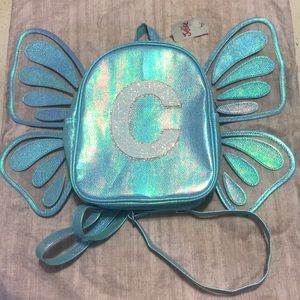 justice butterfly bookbag with a C initial